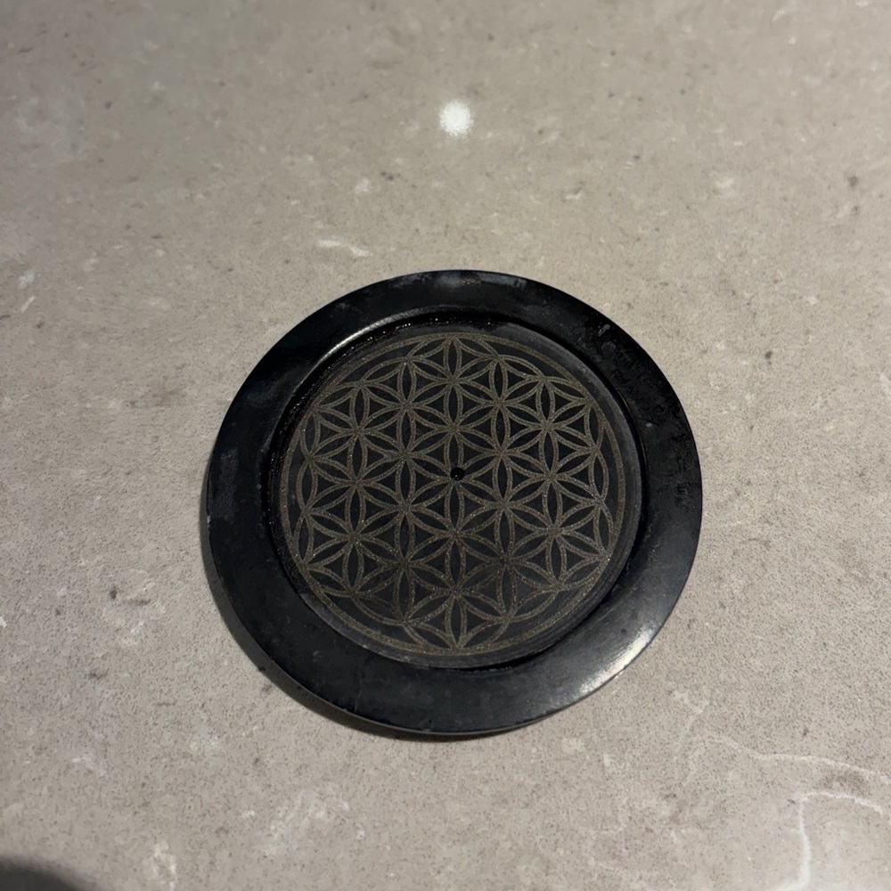 Black Circular Incense Stand with Geometric Design